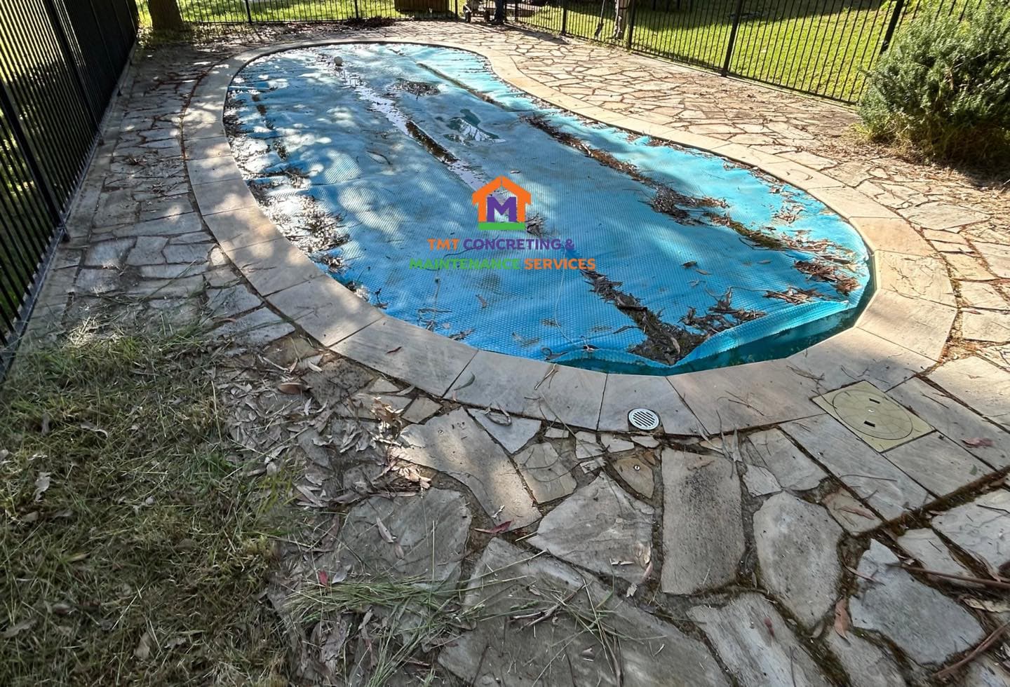 Old cracked pool paving before its spray-pave resurface, Sale