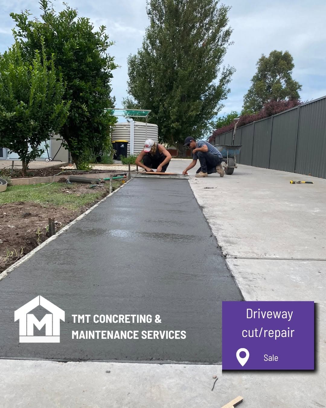 Charcoal-coloured concrete driveway and shed turn bay blending with the existing driveway, Sale