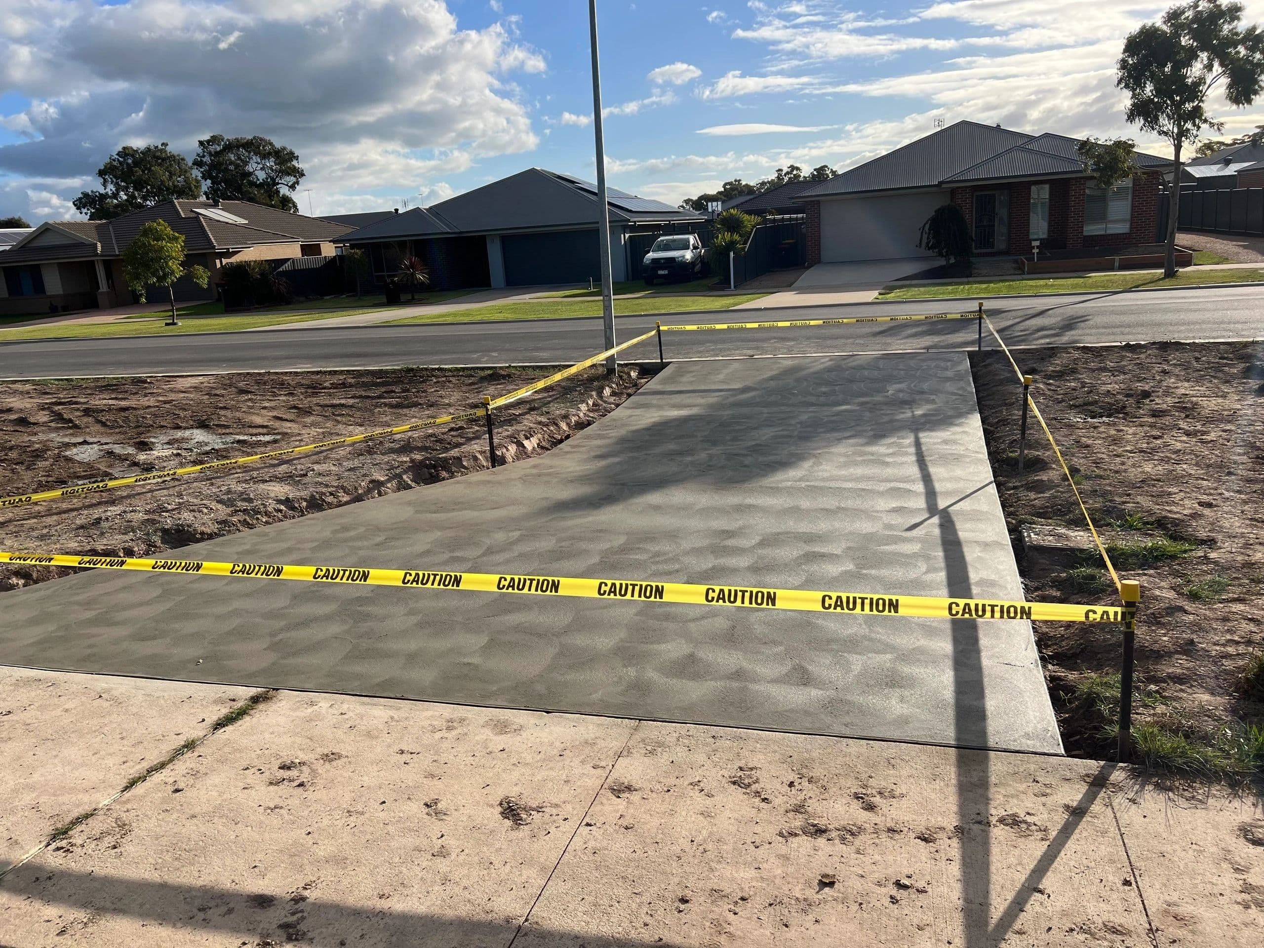 Plain concrete crossover · Stratford — TMT Concreting & Maintenance