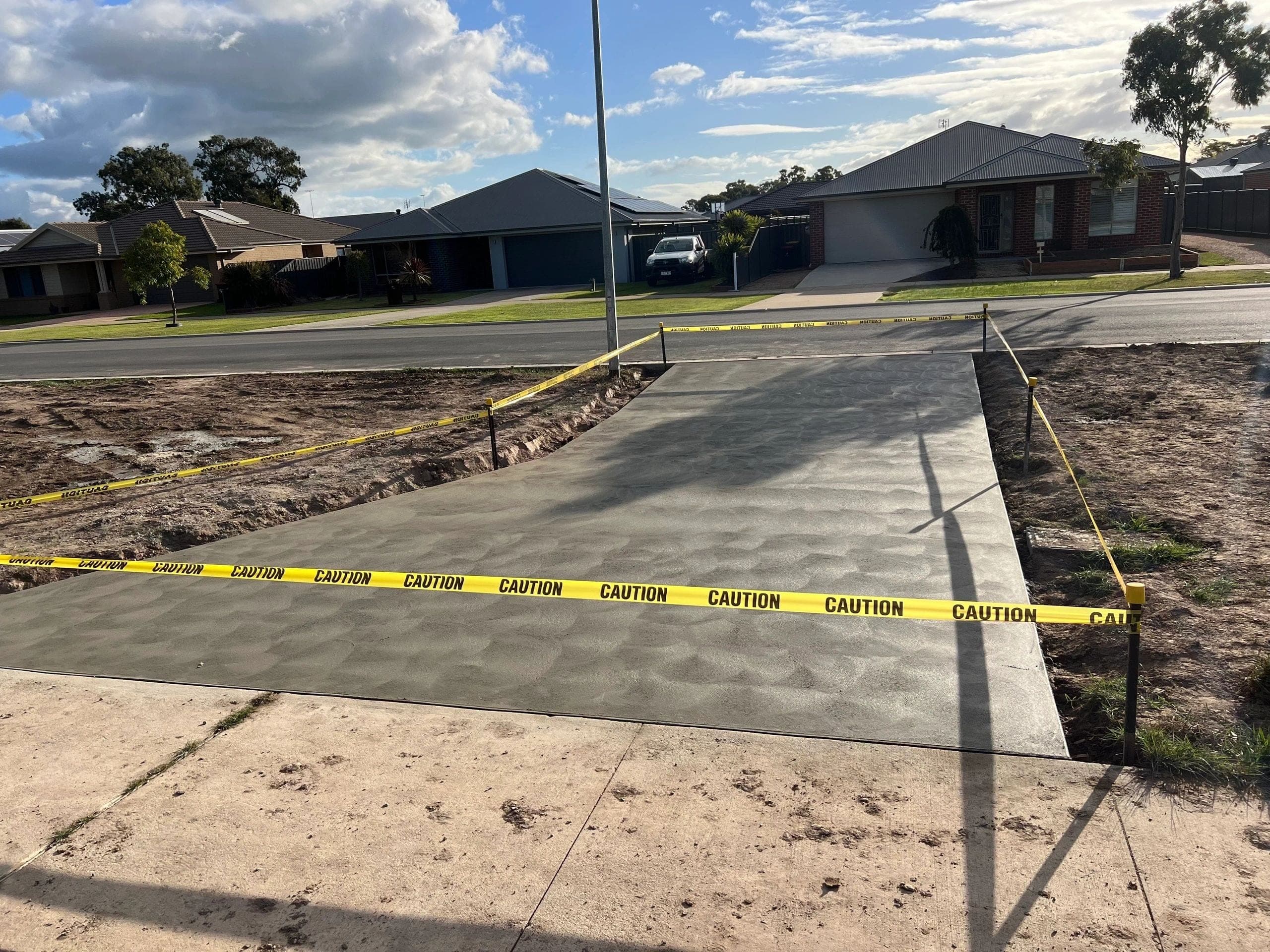 Plain concrete crossover · Stratford — TMT Concreting & Maintenance